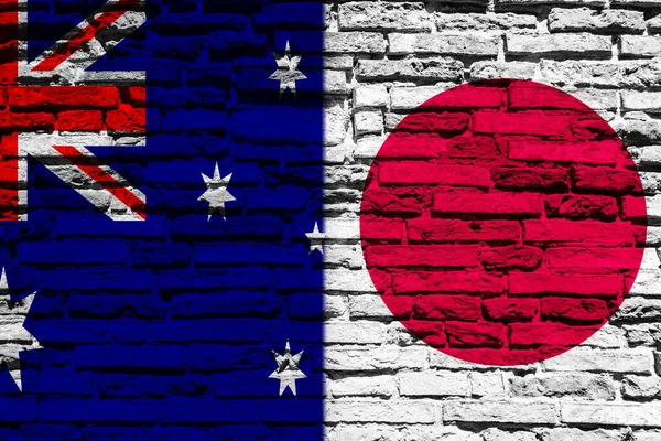 Bakgrund Med Flagga Japan Och Australien Tegelvägg — Stockfoto