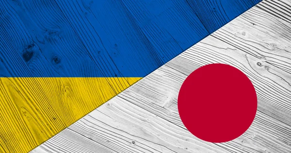 Hintergrund Mit Flagge Der Ukraine Und Japans Auf Geteiltem Holzbrett — Stockfoto