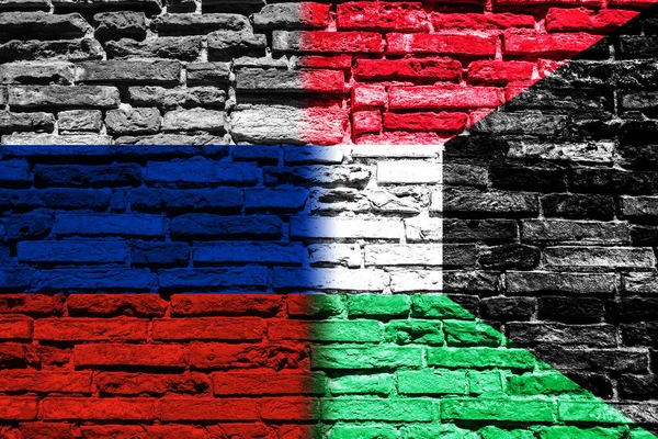 Fondo Con Bandera Rusia Kuwait Una Pared Ladrillo — Foto de Stock