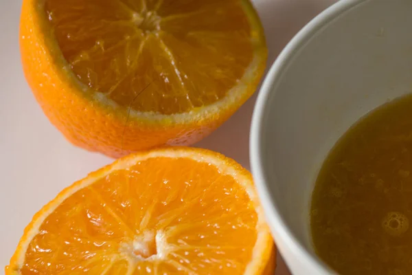 orange fruit in halves , and orange fruit