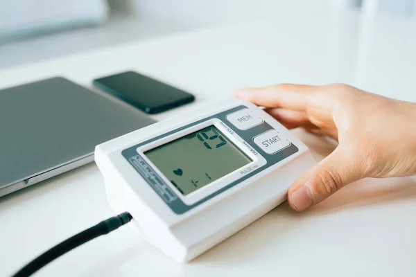 Young Man Checking Measuring Blood Pressure Digital Tonometer Home Holding — Foto de Stock