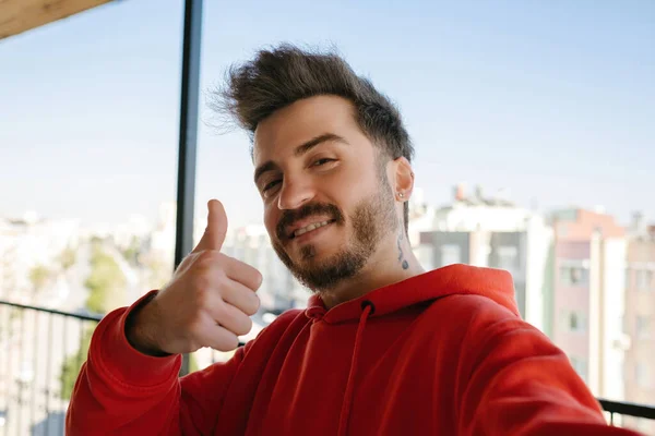 Handsome Young Man Wearing Red Hoodie Taking Self Portrait Outdoor — Zdjęcie stockowe