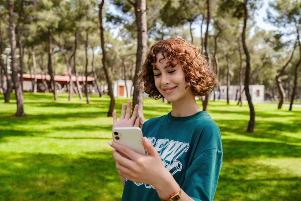 Young Redhead Happy Woman Doing Video Call Phone Waving Hand — Foto Stock