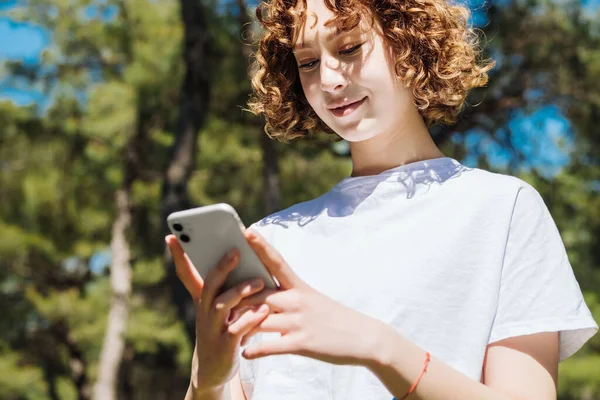 Young Redhead Woman Wearing White Tee Using Her Smart Phone — Foto Stock