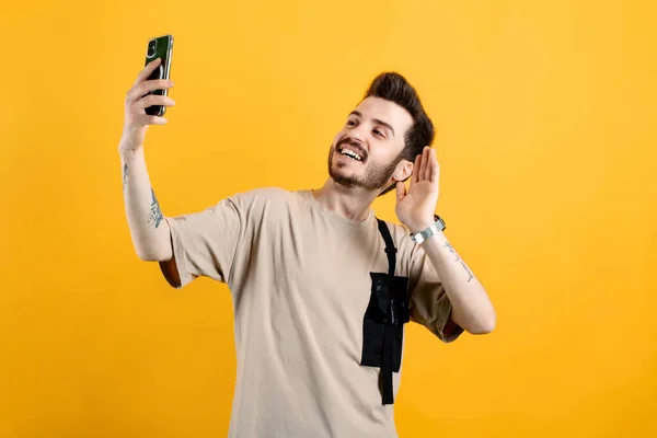 Young Man Wearing Beige Shirt Posing Isolated Yellow Background Taking — Stock Photo, Image