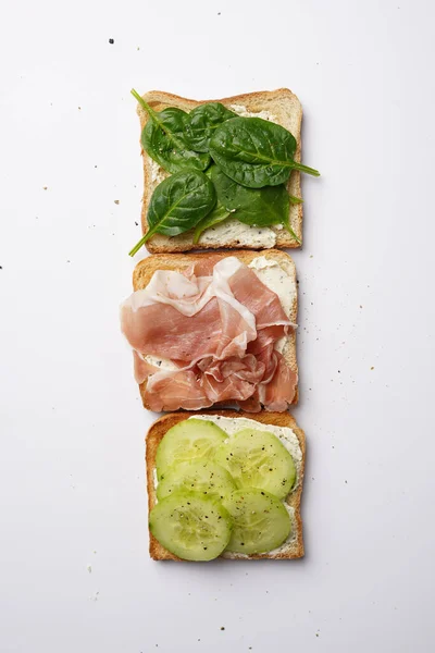 White Toasts Cream Cheese Ham Cucumbers Spinach White Surface — Stock Photo, Image
