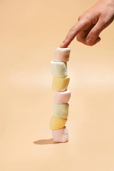 Several Colorful Marshmallows Stacked Top Each Other Balance Female Finger — Stock Fotó