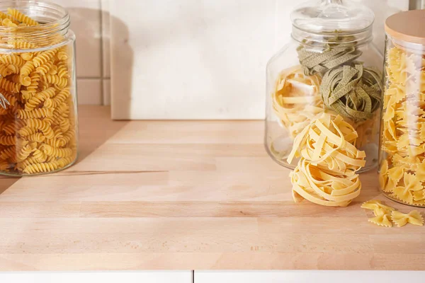 Variety Dry Italian Pasta Glass Jars Kitchen Cabinet Wooden Top Stock Image