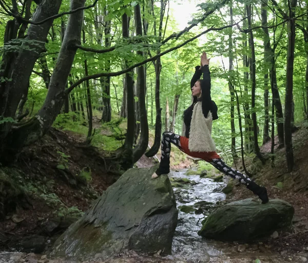 Woman Demonstrates Yoga Pose Stream — стоковое фото