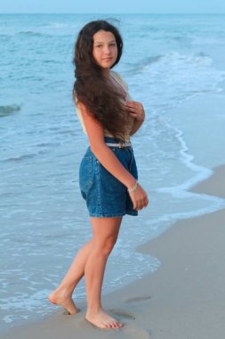 teenage girl on the sea beach, sunset, black sea, Ukrain
