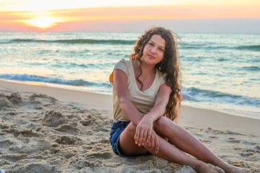 teenage girl on the sea beach, sunset, black sea, Ukrain