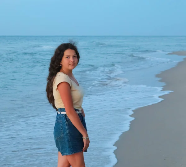 teenage girl on the sea beach, sunset, black sea, Ukrain