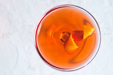 Boulevardier cocktail served up on white ceramic background