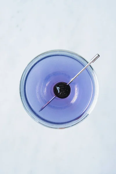 Modified aviation cocktail with a maraschino cherry