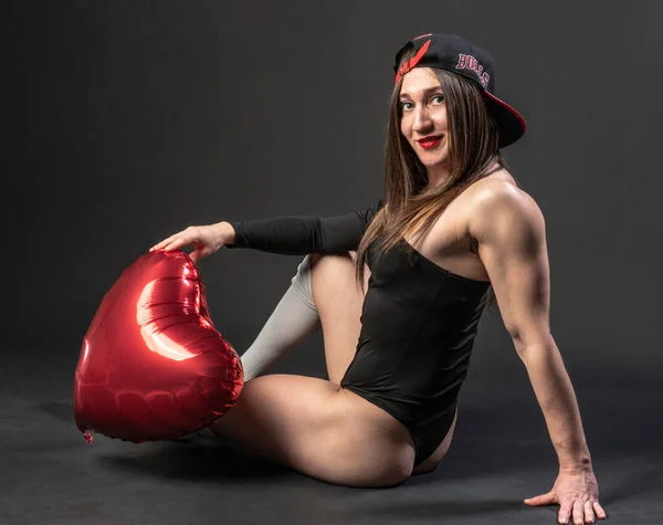 Fitness woman gym black. In a black bathing suit. , human leg adult. figure, torso Caucasian ethnicity. Happy Valentines Day — Stockfoto