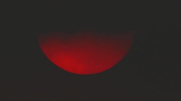 Red dawn of the sun through the clouds. foggy morning. — Stock Video