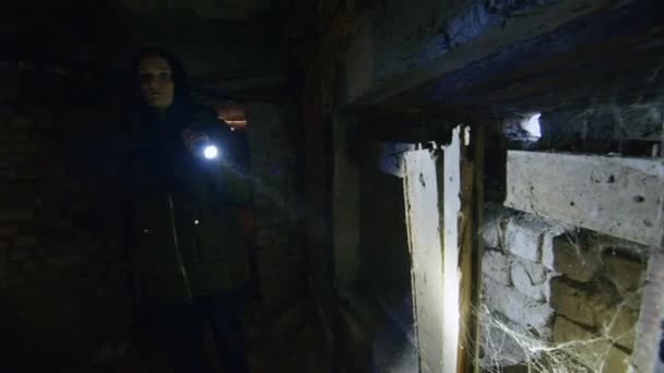 Krivoy Rog, UKRAINE - FEBRUARY 2022 a sad girl is looking in the basement for a place to hide in case of an air attack. bomb shelter in ukraine. Russian attack on the territory of Ukraine. News about — Free Stock Video