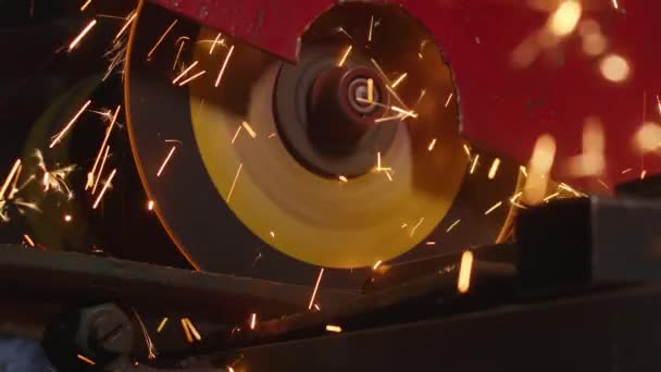 Close-up, cutting of metal structures, making homemade armor plate by professional worker using a cutting machine. cutting work with smooth equipment for steel metal, iron, sparks in a heavy industry — ストック動画