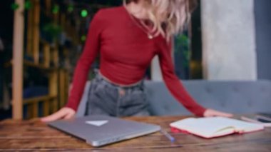 sad tired young woman works with computer at the table. business time. rest and work