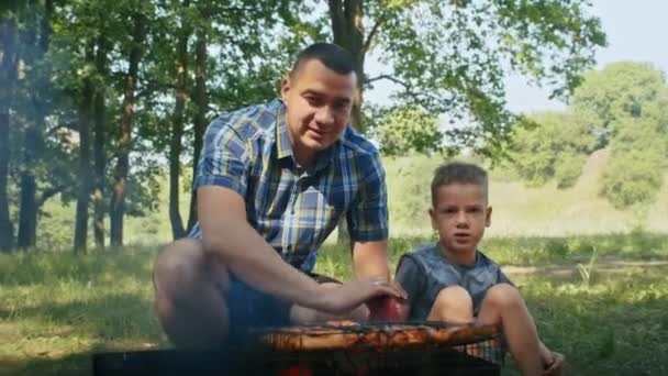 Man His Son Roasts Meat Fire Forest Family Summer Camp — стоковое видео