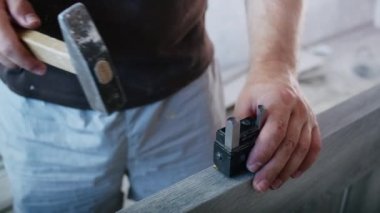 a professional male master is installing doors in an apartment