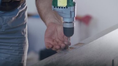 a professional male master is installing doors in an apartment