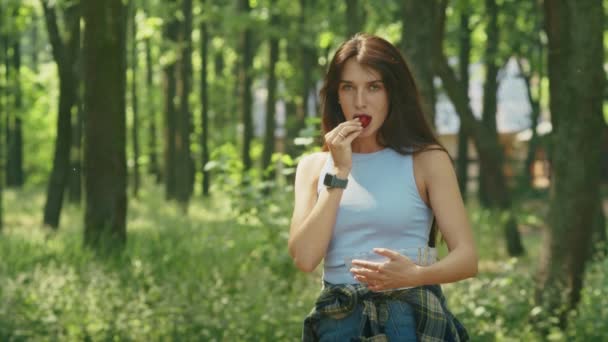 Happy Woman Enjoying Eating Ripe Strawberries While Standing Forest Family — Stockvideo