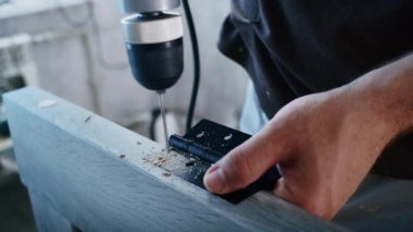 a professional male master is installing doors in an apartment