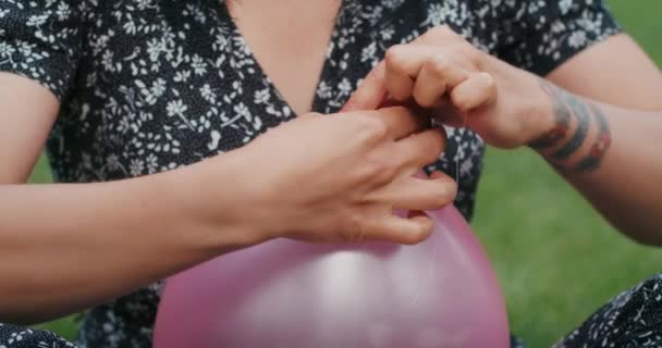 Happy Joyful Woman Inflates Balloons Burst Showing Everything Wrong Condoms — Video Stock