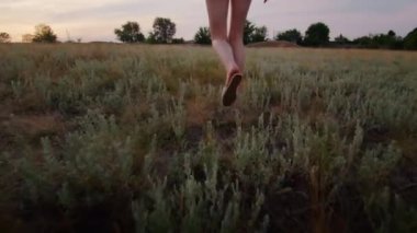 happy young woman enjoying the sunset, wearing traditional ukrainian clothes. lifestyle in Ukraine