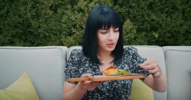 Happy Woman Enjoys Food Restaurant Cafe She Eats Delicious Food — Vídeos de Stock