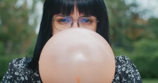 Happy Joyful Woman Inflates Balloons Burst Showing Everything Wrong Condoms — Vídeo de Stock