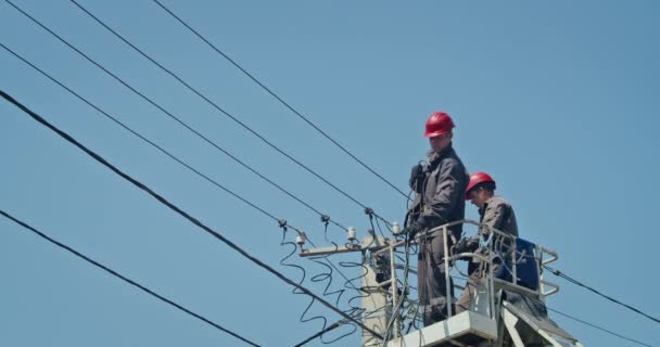 Team Male Electricians Perform Work Replacement Cable — Stockvideo