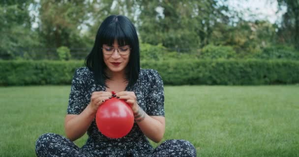 Happy Joyful Woman Inflates Balloons Burst Showing Everything Wrong Condoms — Vídeo de Stock