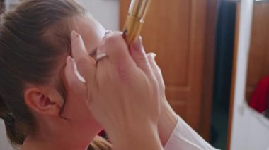 cosmetics and work as a stylist and makeup artist, women paint lips, eyes, face,