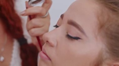 cosmetics and work as a stylist and makeup artist, women paint lips, eyes, face,