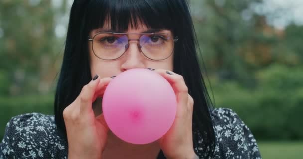 Happy Joyful Woman Inflates Balloons Burst Showing Everything Wrong Condoms — Vídeos de Stock