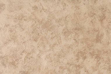 Eski bir bej beton arka plan. Boyanmış bir duvar dokusu..