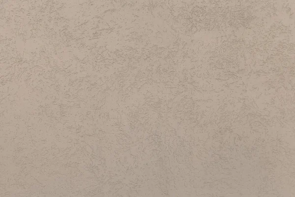 A concrete wall painted in beige color. Abstract background. A plaster wall texture. — Stock Photo, Image