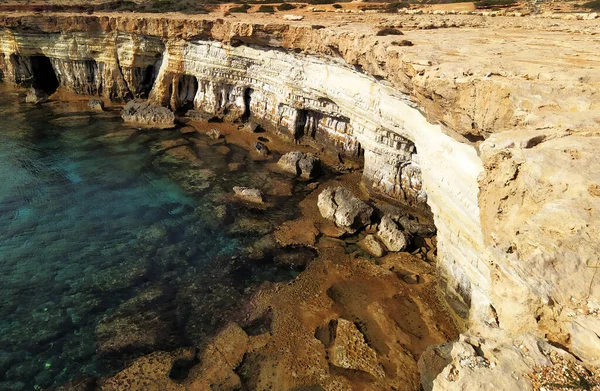 Sea caves in Ayia Napa, Cyprus. Mediterranean Sea coast. Beautiful cliffs with caves near Cavo Greco. — Stock Photo, Image