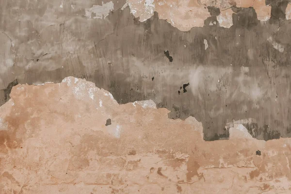 Eski yıpranmış bir duvar ve soyulmuş boya. Grunge desenli beton yüzey, soyut arkaplan.