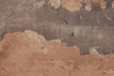 Soyut arkaplan ve grunge dokusuna sahip beton yüzey. Eski yıpranmış bir duvar ve soyulmuş boya..
