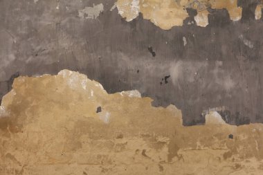 Yıpranmış eski bir duvar, grunge desenli. Soyulmuş boyalı beton yüzey, soyut arkaplan.
