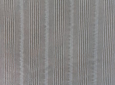 Bej kumaş dokusu. Orijinal tekstil arka planı. Doğrusal süslemeli yatak örtüsü. Tasarımlarınıza kolayca derinlik ve organik doku ekleyin.