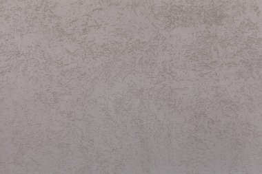 Alçıdan duvar dokusu. Soluk pembe renge boyanmış beton bir duvar. Soyut arkaplan. Kısa bir fotoğraf ve mesaj için yer var. Tasarımlarınıza kolayca derinlik ve organik doku ekleyin.