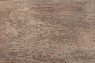 Paint brushed beige background. An old wall with detailed texture. A concrete plastered surface with brush strokes. Minimal urban photo. Easily add depth and organic texture to your designs.