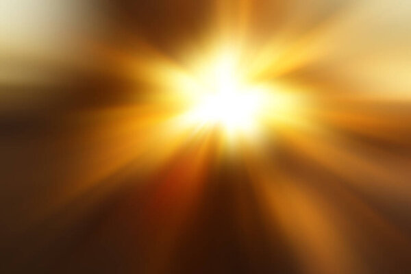 Abstract blurred brown and yellow  background with a flash and diverging rays in the middle