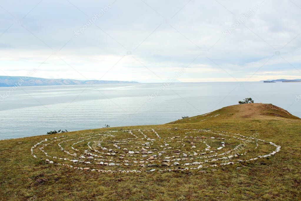 Ritual stone pattern on the cape Burkhan on Lake Baikal. Olkhon Island, Russia