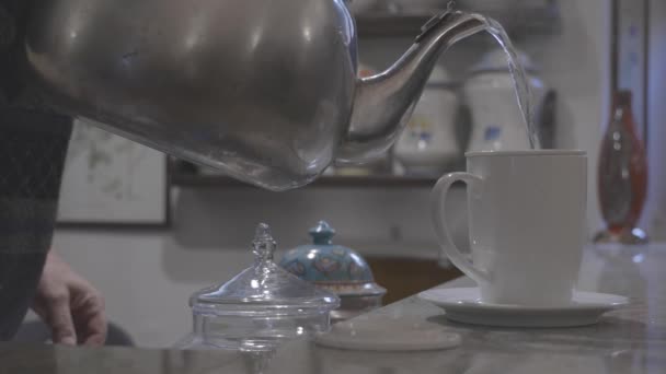 Hand Pours Boiling Water Cup Herbal Tea Takes Two Biscuits — Stock Video