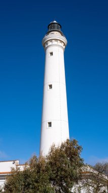 Lighthouse of San Vito Lo Capo, Sicily, Italy. lighthouse with blue sky on the bottom.